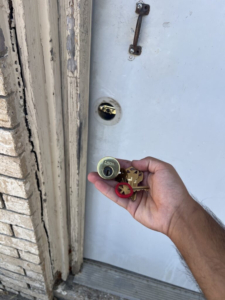Residential door lock cylinder and newly cut keys after a rekey