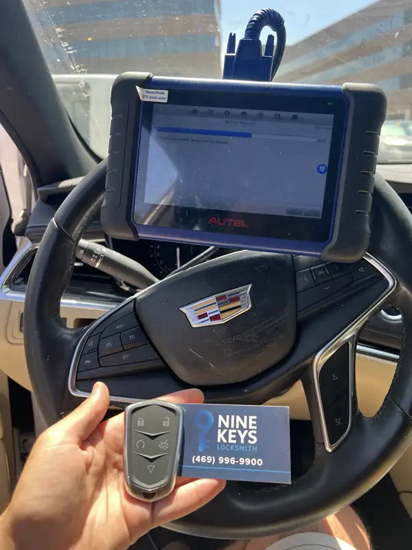 Programming a new smart key for a 2017 Cadillac XT5 in Richardson, TX, with a Nine Keys Locksmith card